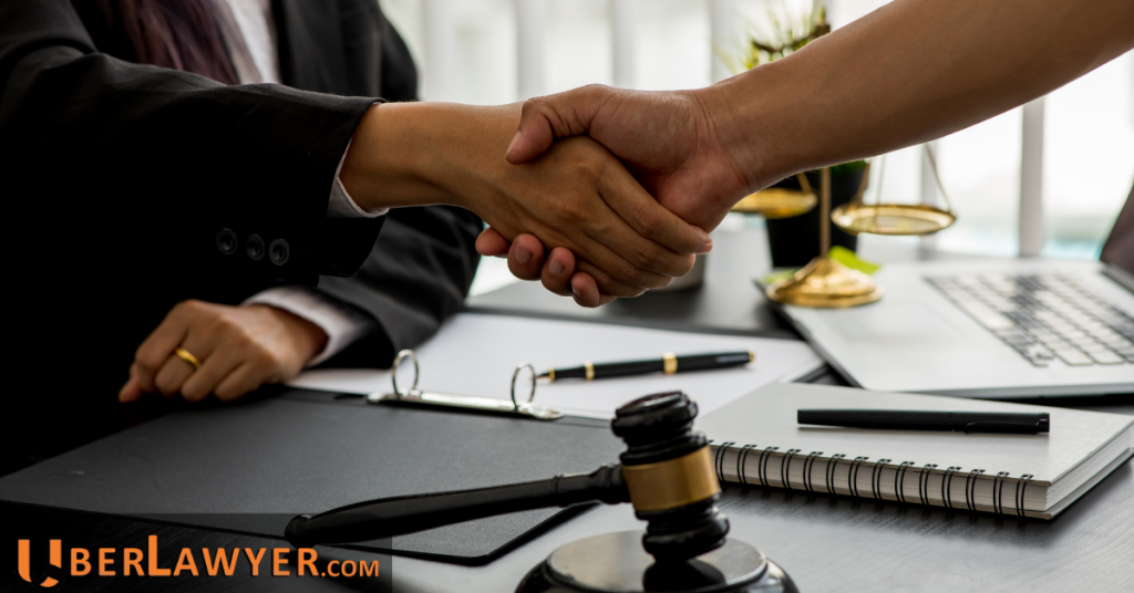 Client shaking hands with an attorney after discussing legal representation for a rideshare accident claim.