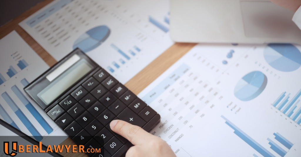 Calculator and financial documents representing rideshare accident attorney fee calculations.